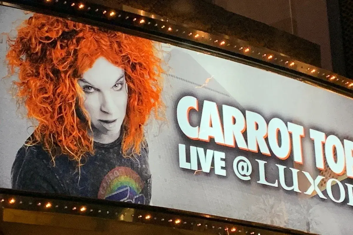Carrot Top performing prop comedy on stage in Las Vegas