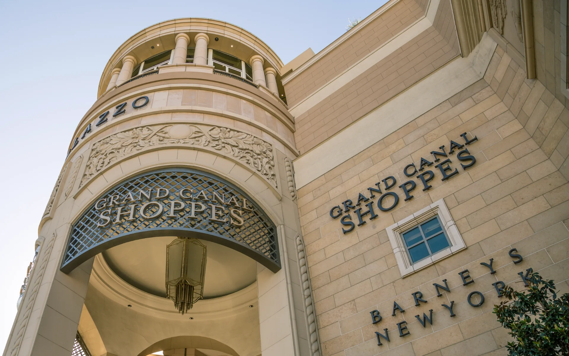 Stone facade of The Palazzo displaying the Grand Canal Shoppes and Barneys New York signage in Las Vegas