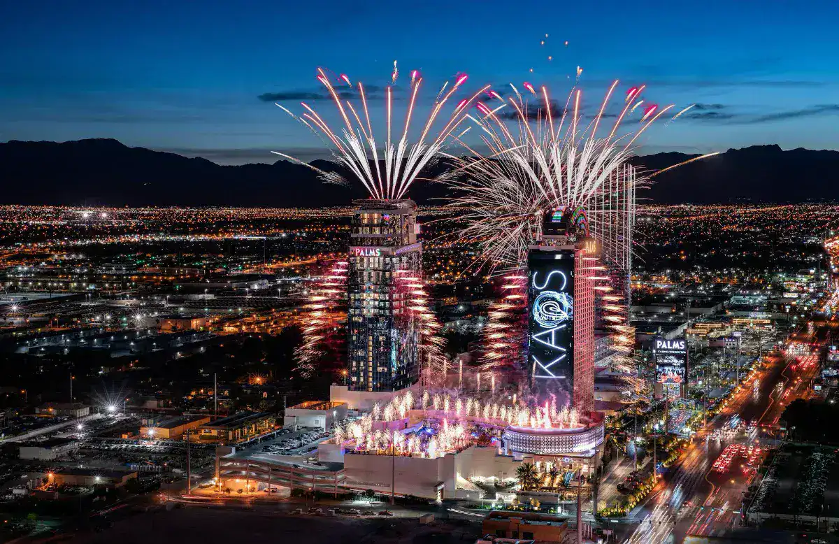 Aerial night view of the Palms with fireworks over the Kaos pool
