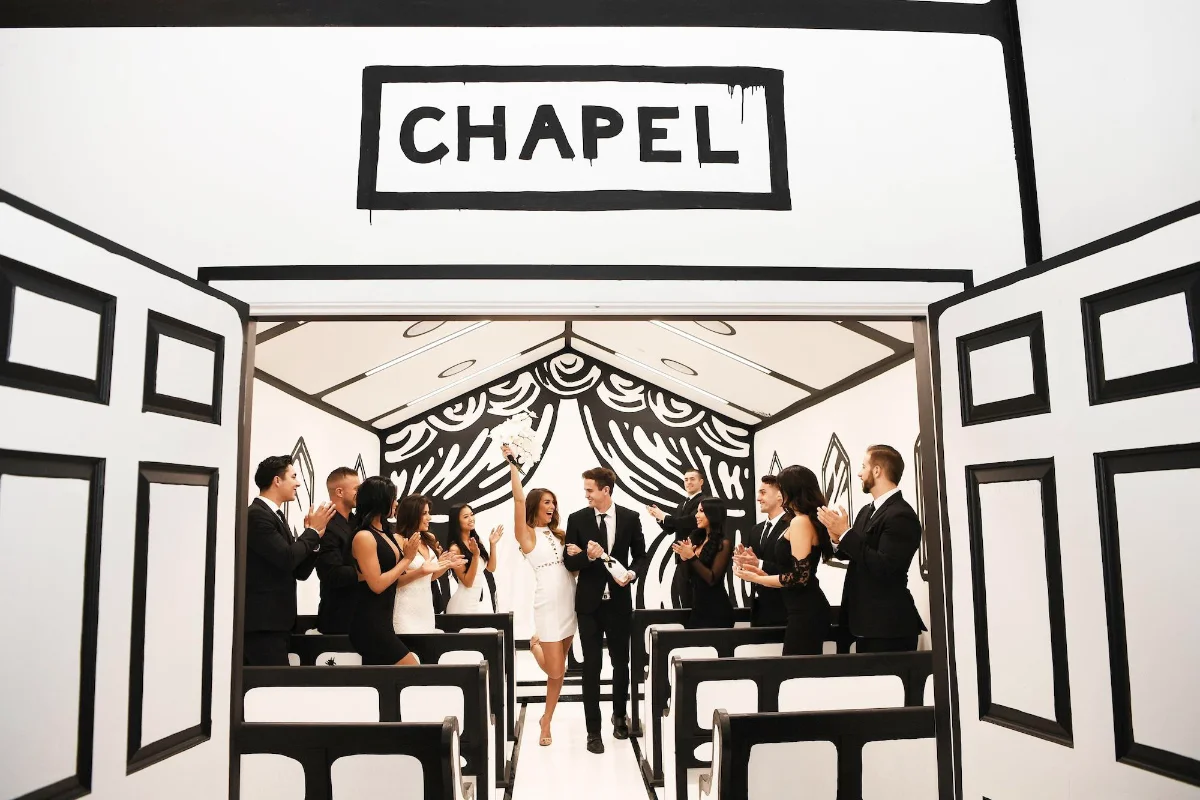 Black-and-white wedding chapel with a celebrating couple at the Palms