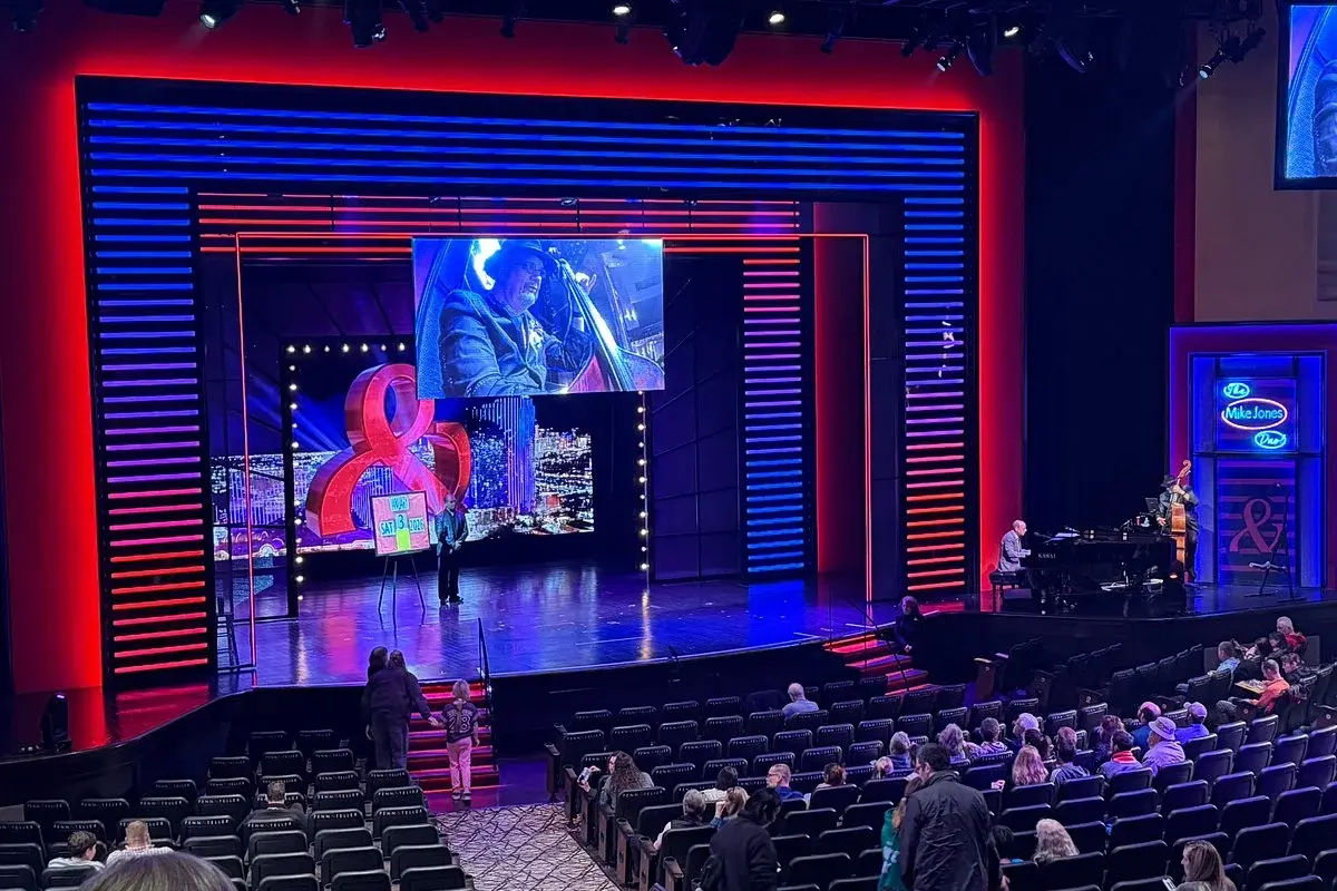 Penn & Teller performing a magic and comedy routine in Las Vegas
