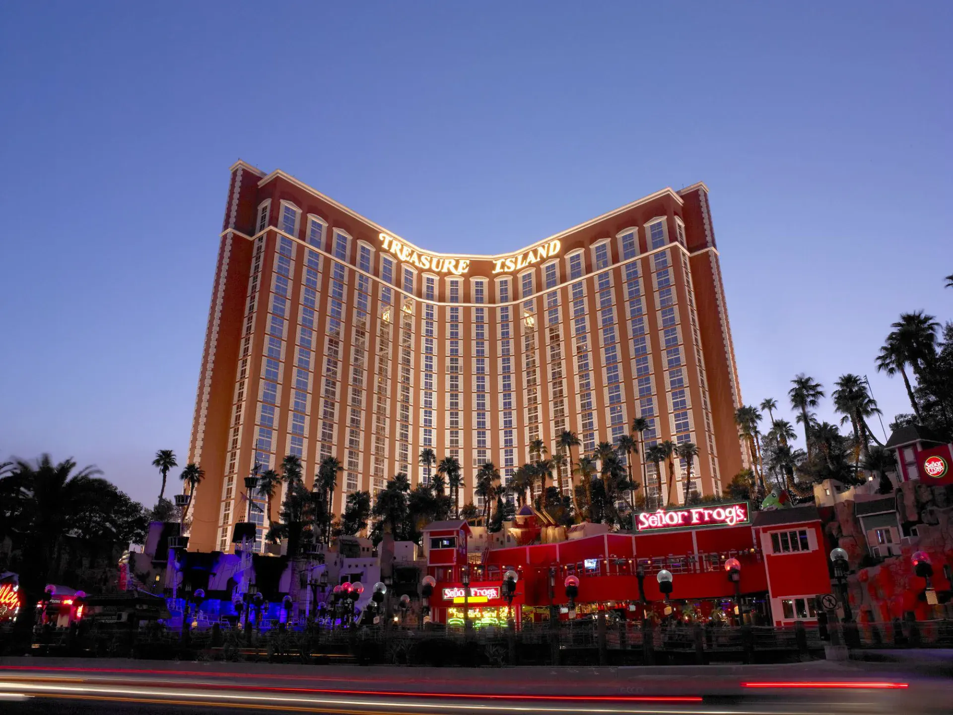 Treasure Island Las Vegas curved tower at dusk on the Strip