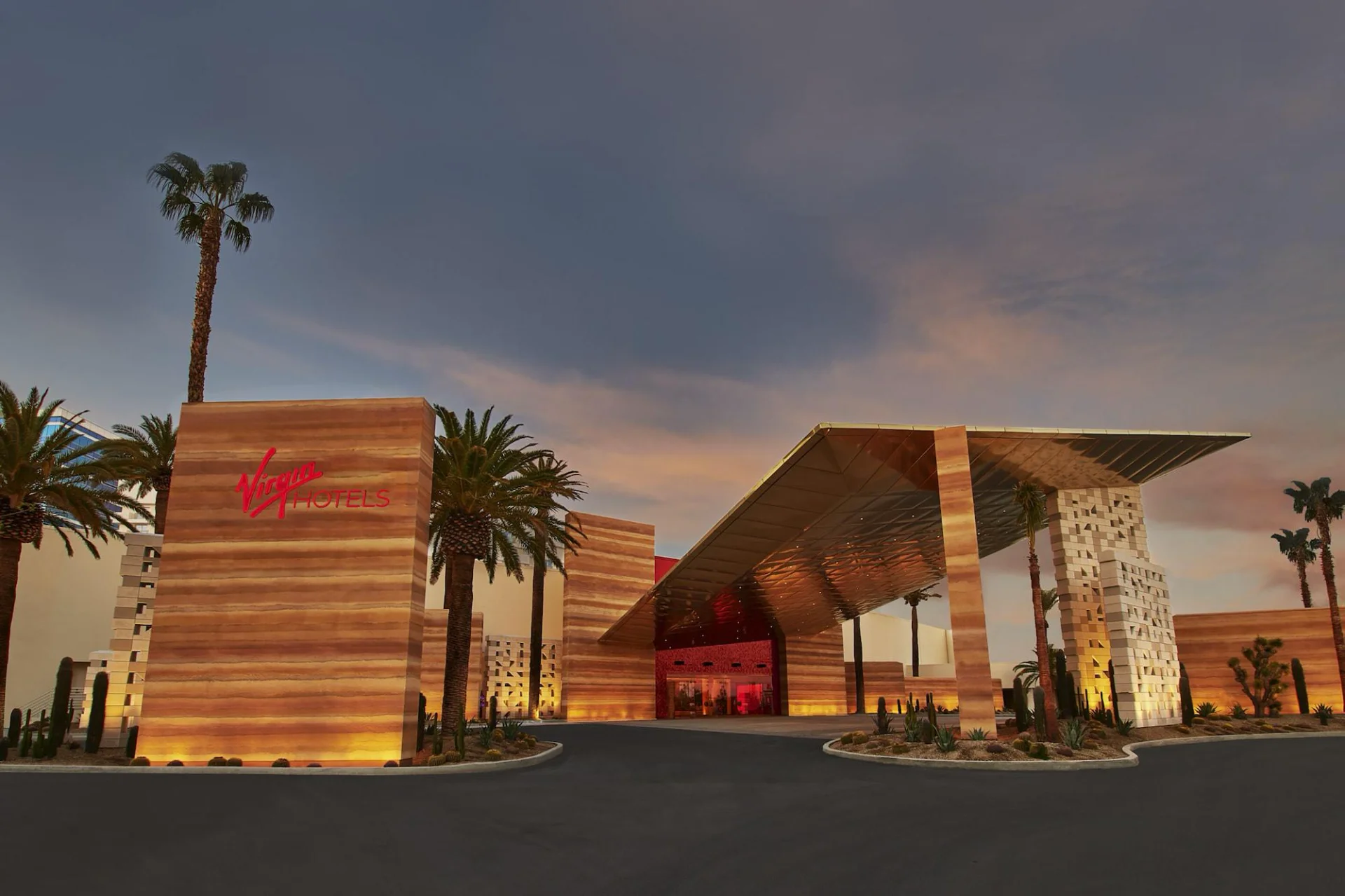Virgin Hotels Las Vegas wood-clad entrance at dusk