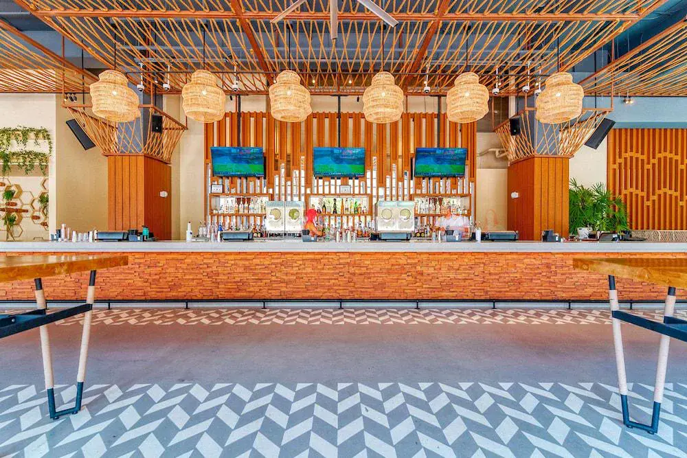 Colorful bar with herringbone tile floor at Virgin Hotels Las Vegas