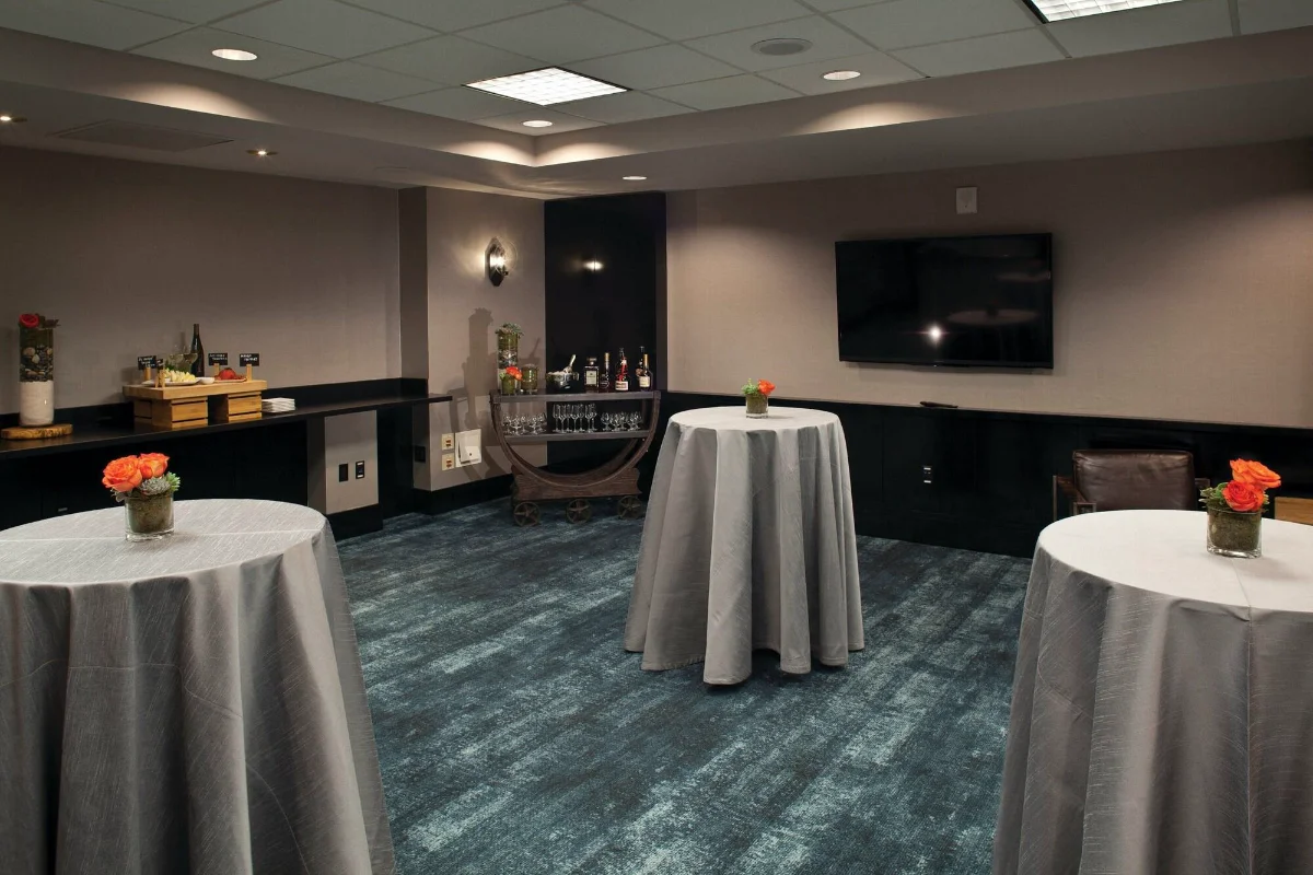 Event room set with cocktail tables and a bar cart at W Las Vegas
