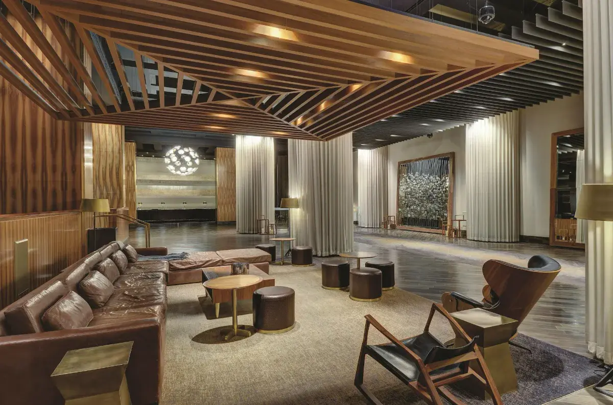 Lobby lounge with slatted wood ceiling and leather seating at W Las Vegas