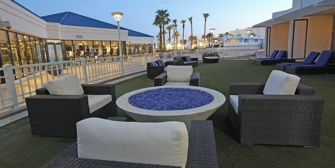 Outdoor patio with fire pit and lounge seating at Westgate Las Vegas