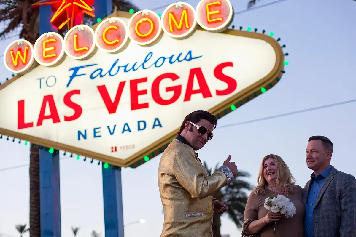 Visitors at the Welcome to Las Vegas sign